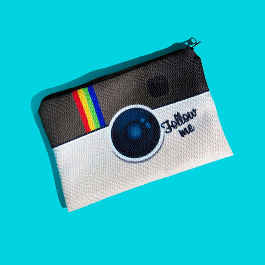 Turquoise background. An oblong shaped pouch (for carrying spare or used pairs) has been designed to look like a camera and displays the words "Follow me".