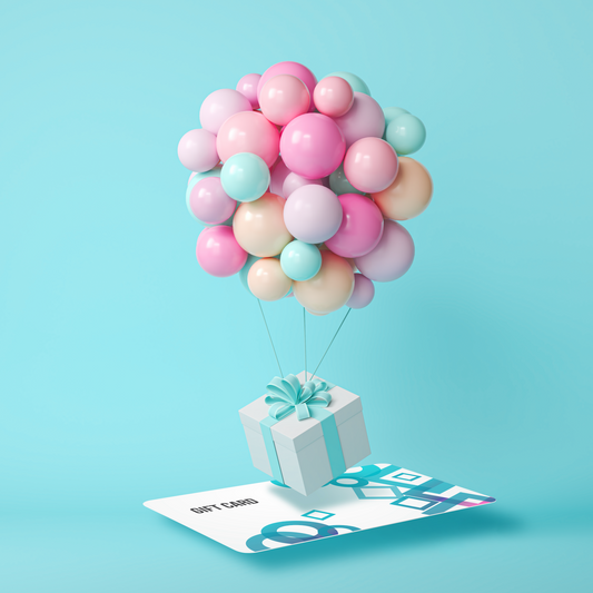 Light turquoise background.  A blue and white gift card  is hovering face up just above the ground.   A large bunch of pink, blue and orange balloons are attached to a white present with a blue ribbon that hovers just above the gift card.  The present looks like it is taking off like a hot air balloon.