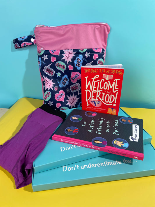 A period starter kit is displayed containing the following; a navy and pink A5 sized waterproof bag with a speech bubble pattern on it. The book 'Welcome to your Period' is standing up and the book 'The Autism Friendly Guide to Periods' is laying down in front. There is a pair of purple 'Popsicle' tween period pants boyshorts to the front left of the box. The background in turquoise and yellow.